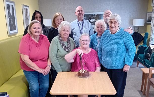 Older residents celebrate the end of their tablet course.